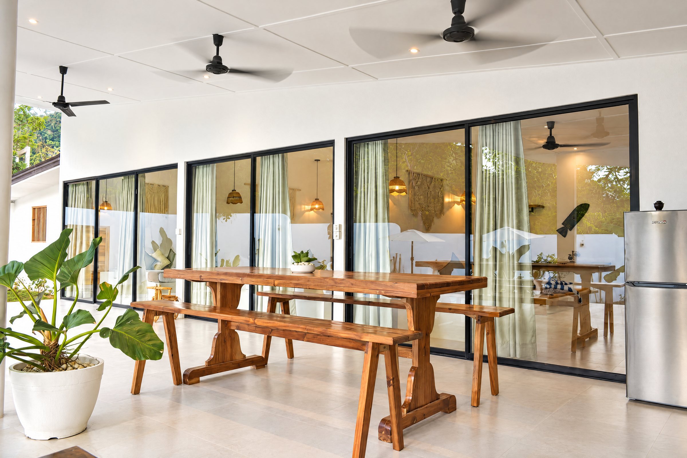 Solid timber dining table on the covered balcony